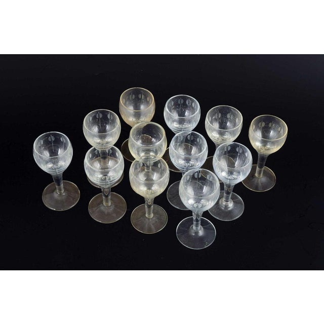 Per Lütken for Holmegaard. Kirsten Piil. 12 schnapps glasses, ca. 1950/60s. Designed by Per Lütken in 1956. Mouth-blown...