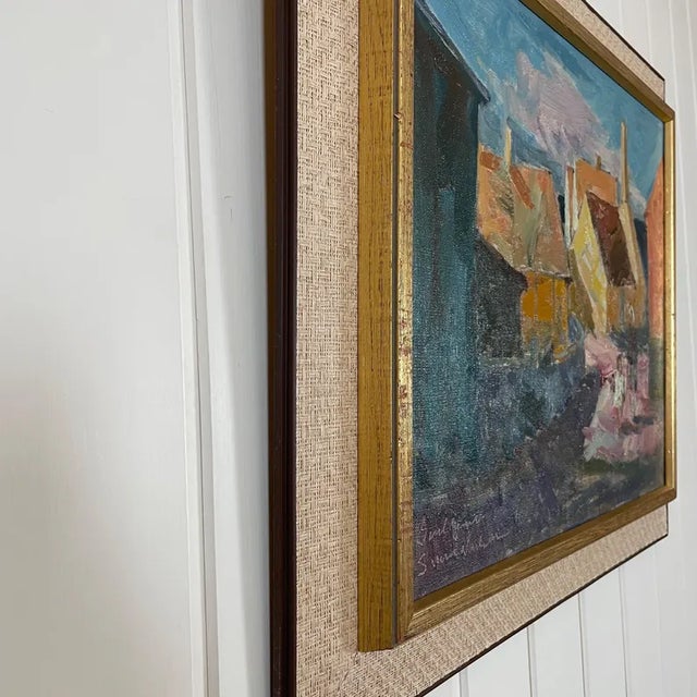 This oil on canvas by Svend Nielsen presents a modernist village scene shaped through softened contours and a carefully...