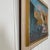 This oil on canvas by Svend Nielsen presents a modernist village scene shaped through softened contours and a carefully...