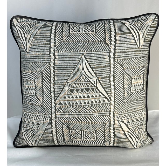 A tribal geometric featuring pyramids, squares all laid out in a grid. Fortuny’s unique discharge printing technique adds...