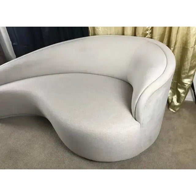 Delivering unparalleled sophistication and glamorous sculptural style, this authentic "Dana" curved chaise lounge by...