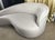 Delivering unparalleled sophistication and glamorous sculptural style, this authentic "Dana" curved chaise lounge by...