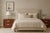 A refined pair of postmodern nightstands attributed to Burlington, featuring strong architectural lines and a warm,...