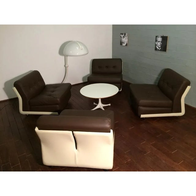 Set of four leather "Amanta" lounge chairs by Mario Bellini for B&B Italia with patina to the original leather. Each chair...