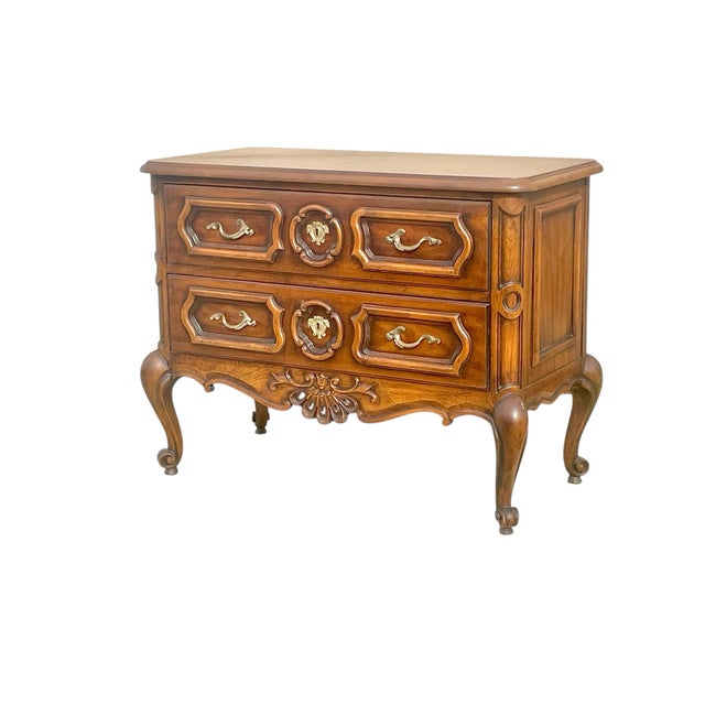 A beautiful 2 drawer commode or low dresser. In the Louis XV / rococo style . Made of walnut with exceptional carving and...