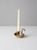 A charming vintage brass chamberstick with a distinctive heart-shaped drip pan and open handle. The warm brass finish and...