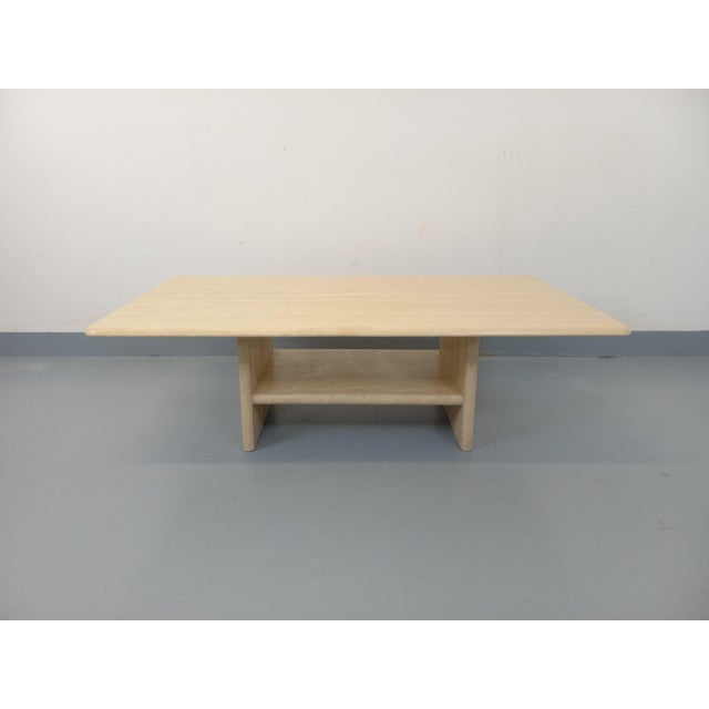 Vintage travertine coffee table from the 1980s, rectangular with a central pedestal incorporating a magazine rack, in very...