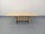 Vintage travertine coffee table from the 1980s, rectangular with a central pedestal incorporating a magazine rack, in very...