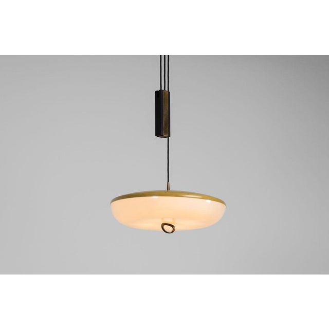 The exceptionally rare model 1177 pulley pendant, crafted by stilnovo in italy around 1960, stands as a remarkable example...