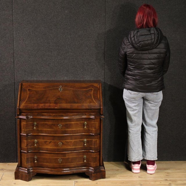 Venetian bureau from the mid-20th century. A beautifully sized and proportioned piece of furniture, carved and veneered in...