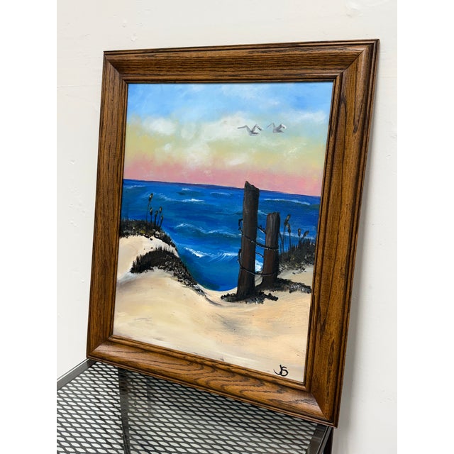 Design Plus Gallery presents a Framed Coastal Beach Seascape Painting. This coastal composition depicts rolling blue ocean...