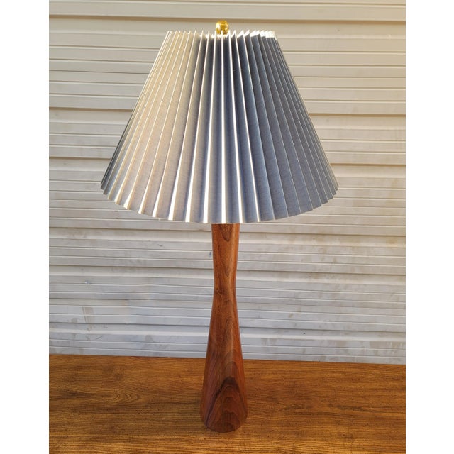 Featured is an extraordinary sculpturesque Mid-Century Modern Solid Teak Tall Table Lamp. The weight and height of this...