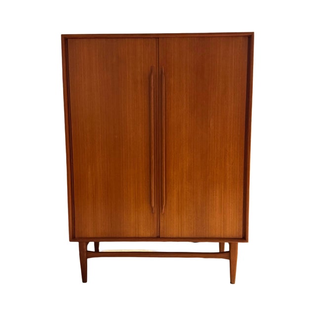 This stylish highboard, attributed to German designer Heinrich Riestenpatt, reflects the elegance and functionality of...