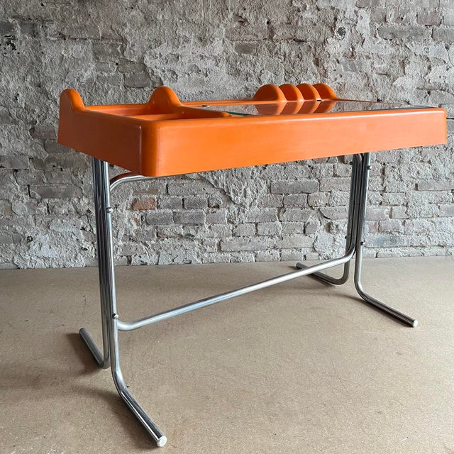 Rare tangerine orix desk by nani prina & vittorio parigi for molteni, 1970's. Molded out of abs plastic. The troughs are...