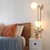 Influenced by the opulence of Hollywood Regency design, the Duo Sconce blends modern elegance with vintage glamour....