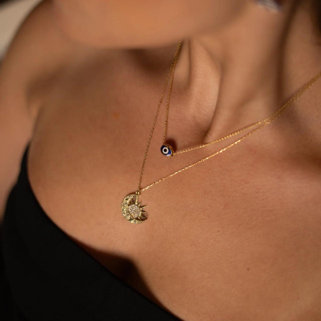 Embrace the cosmic harmony of day and night with our Celestial Sun & Moon Diamond Gold Necklace. Handcrafted in sterling...