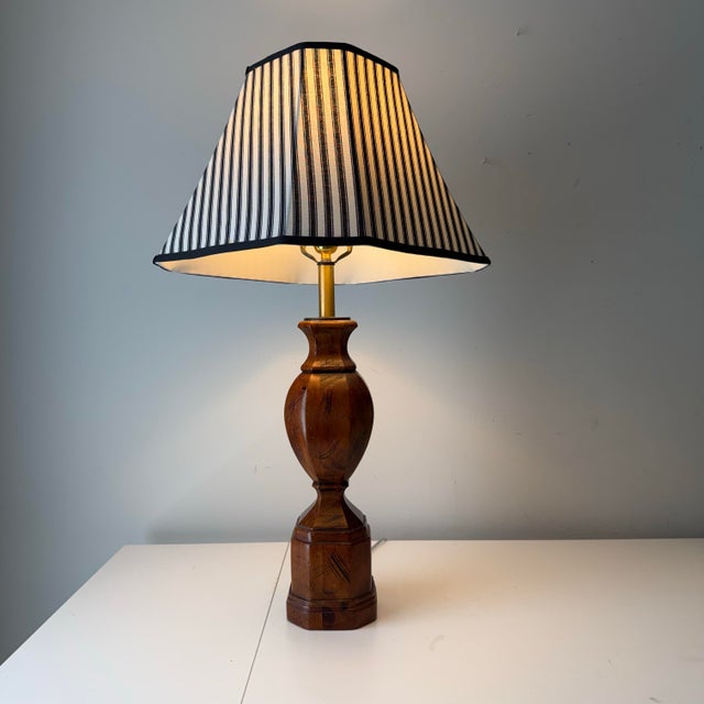 Vintage turned baluster wood table lamp paired with custom square flared striped linen bell shade.