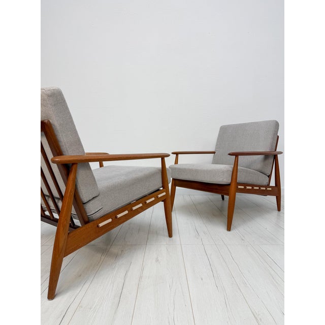 Beautiful vintage Danish armchair from the 1960s. This elegant armchair features a high-quality solid teak frame that...