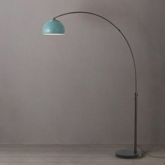 Featuring a sweeping, gracefully arched silhouette, the Half Dome Arc Lamp is a modern arc lamp designed by Peter Morelli...
