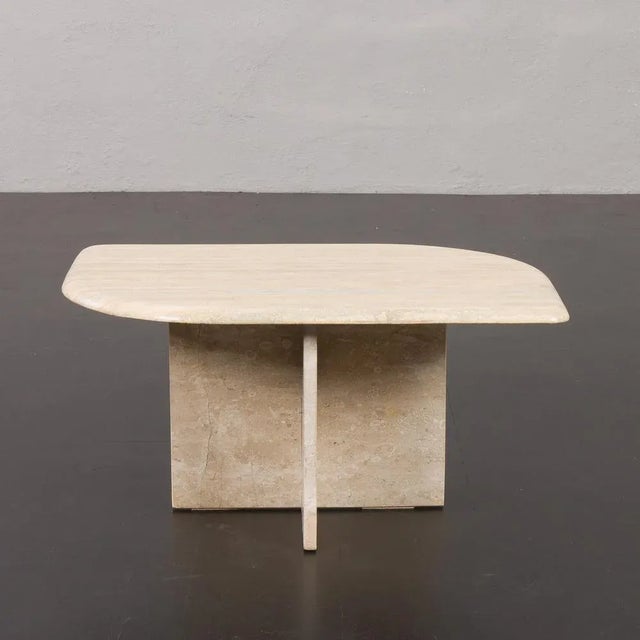This exquisite Italian midcentury travertine coffee table comes from the 1970s. The sleek and compact coffee table has an...