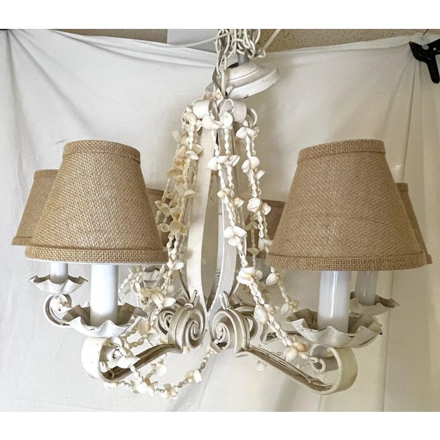 Fabulous turn of the century forged iron chandelier. This unique fixture has six lights, and was painted at some point in...