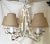 Fabulous turn of the century forged iron chandelier. This unique fixture has six lights, and was painted at some point in...