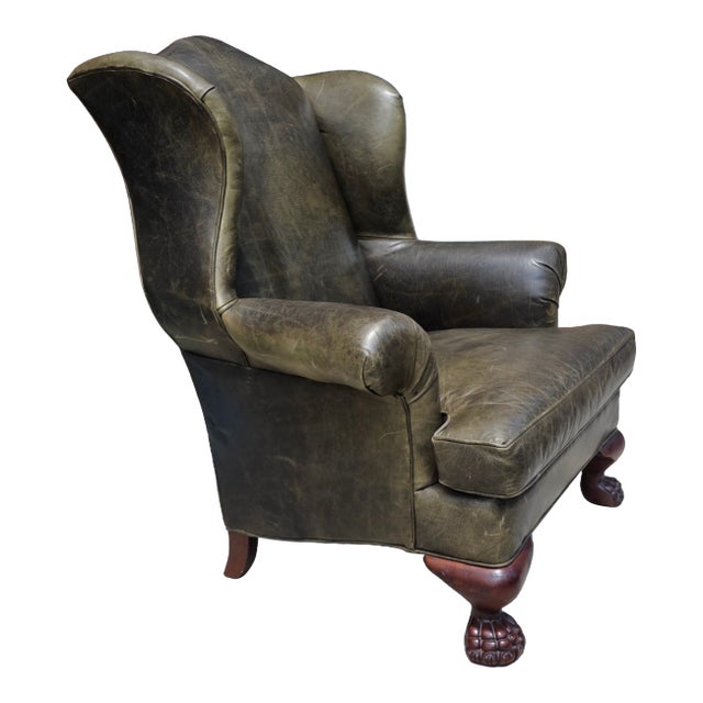 Vintage English Georgian Style Distressed Olive Green Leather Wingback Library Armchair With Ball & Claw Feet For Sale