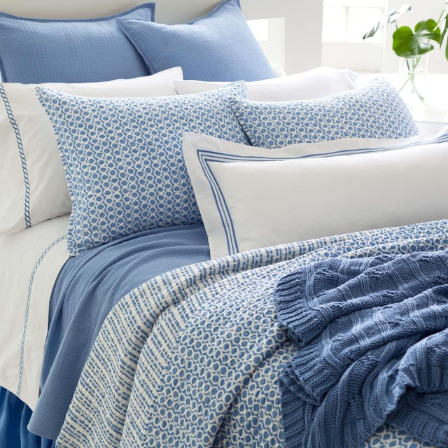 Mixing up your décor has never been easier than with this reversible cotton quilt in a classic French blue. Featuring a...