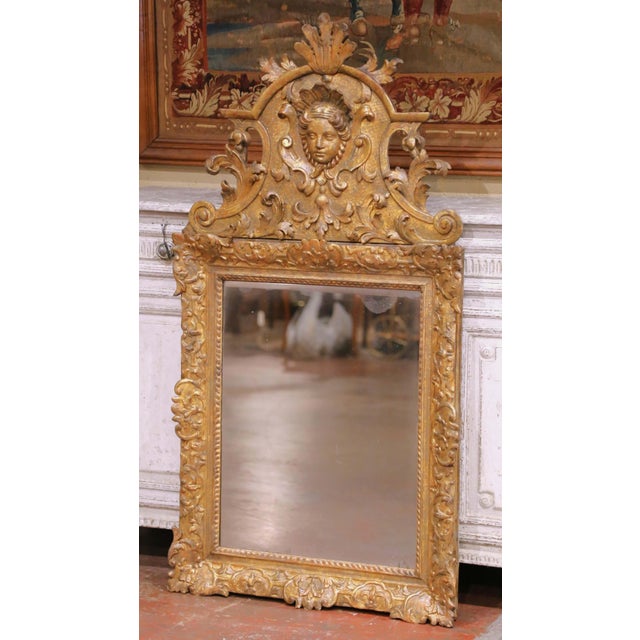 Make a strong decorative statement with this exquisite French Régence antique mirror, richly carved in giltwood circa...