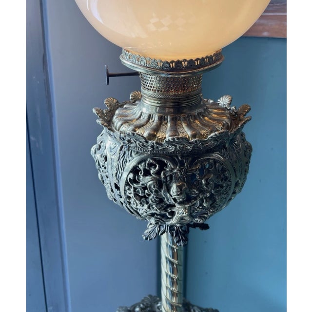 Incredible ornate brass floor lamp with hand painted glass shade from makers Bradley and Hubbard as signed on turn switch...