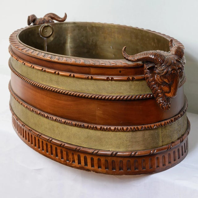 Just in, this Antique English Large Mahogany Ram Heads Cellarette Bottle Cooler. This cellarette still has the original...