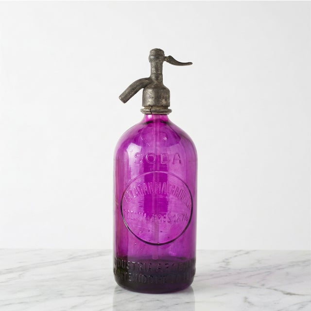 Original vintage seltzer bottles from pre-1940s Argentina; the dates are stamped on the metal neck of each bottle. Our...