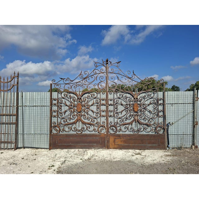 Impressive Antique Double-Leaf Gate in Solid Wrought Iron in Baroque Style Extraordinary and imposing antique double-leaf...