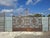 Impressive Antique Double-Leaf Gate in Solid Wrought Iron in Baroque Style Extraordinary and imposing antique double-leaf...