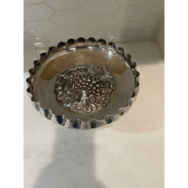 This Walker & Hall Sheffield silverplate fruit compote was made in England between 1900-1940. The high relief silverplate...