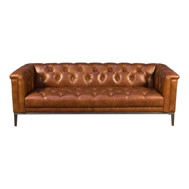Mid Century modern style tufted leather upholstered sofa with a vintage brown top grain leather, with a tufted backrest...