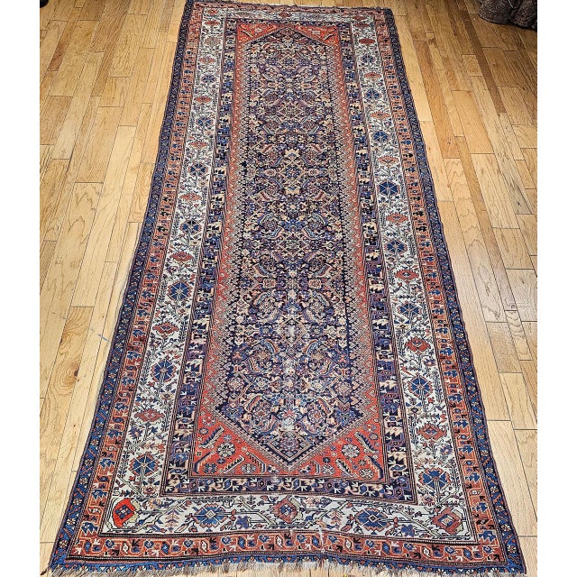 This vintage Persian Malayer gallery rug from the early 20th century (circa 1900–1925) showcases the enduring beauty of...
