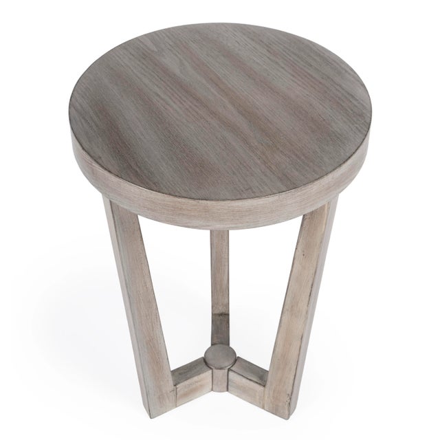 This uncomplicated modern accent table is a great finishing touch in any space. Its three legs taper and conjoin to...