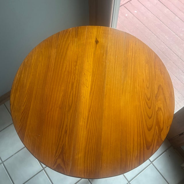 All original; Made from yellow pine; no stain, only a clear coat; table is adjustable by turning the top to raise or...