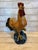 A richly colored vintage ceramic rooster with expressive modeling and a lustrous glazed finish, capturing the decorative...
