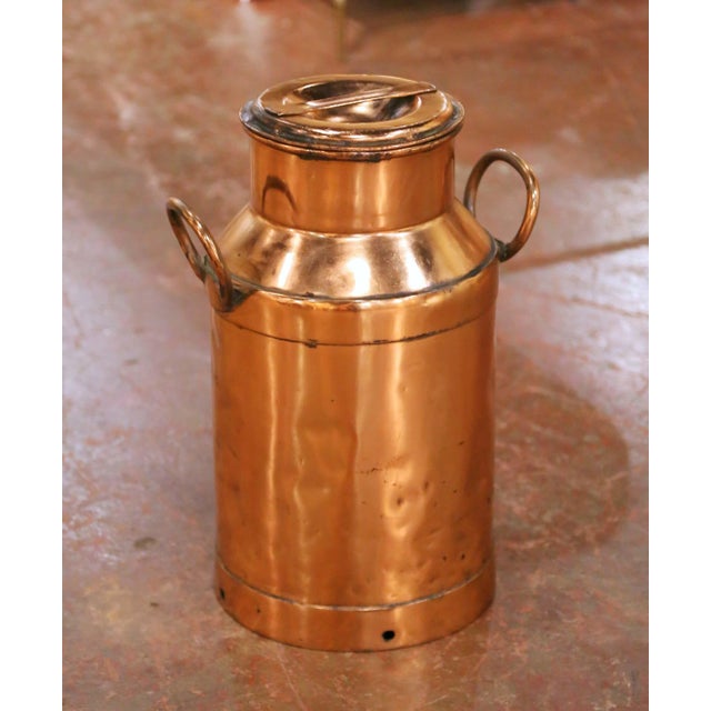 This antique French copper milk can was crafted circa 1890 and reflects the honest utilitarian charm of rural dairy life....