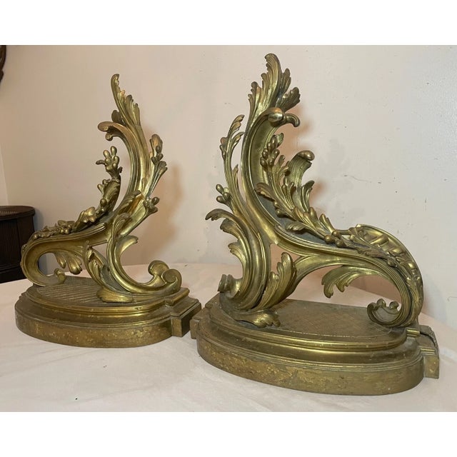 Up for sale is a very nice quality pair of antique Rococo style gilt bronze fireplace andirons. The pair is made of a gold...