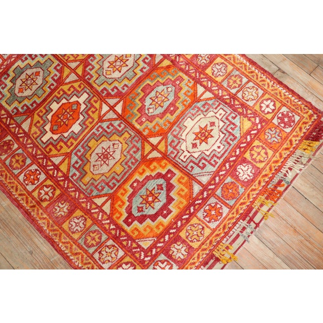 Bright colors highlight this early 20th century Turkish Bergama rug Measures: 3'6” x 4'4”.