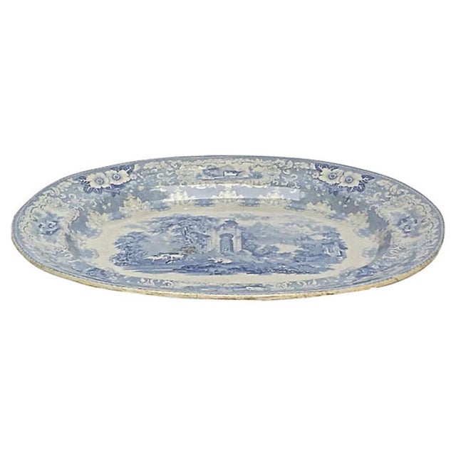 Antique palace garden scene transferware serving platter. The scene depicts a portion of a palace within the gardens and...