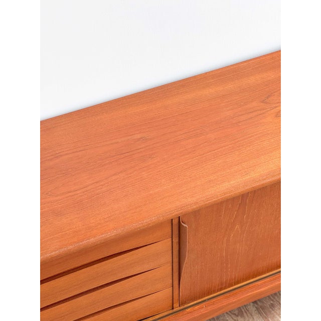 Dimensions 240x47x80 cm (lxdxh) this elegant danish design sideboard was designed by axel christensen odder (aco) in the...