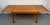 A beautiful mid-century modern Danish draw-leaf dining table crafted in warm, richly grained teak. The versatile design...