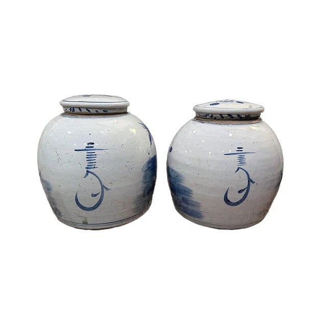 This is a pair of large contemporary an ink blue and stone greyish white Chinese porcelain ginger jars. These two rounded...