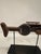 One of a kind wonderful folk art sculpture of a machine gun in rustic wood with some of its original painted finish. The...