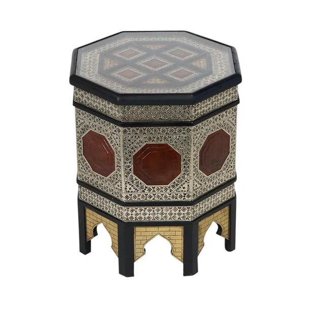 Elegant and traditional, these Moroccan side or end tables are crafted from wood and feature intricate metal overlay work...