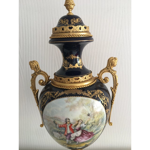 24" tall ACF Victorian Romantic French porcelain gilt metal décor de serves imperial cobalt blue vase. This is one from...